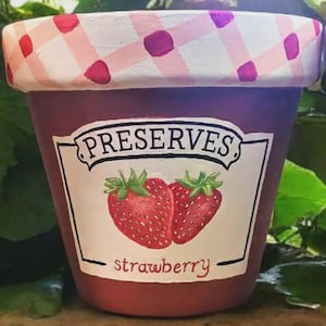 Handmålad blomkruka med gelékonserver