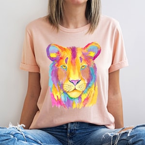 A short sleeve crew neck t shirt with a colorful neon lion graphic. The shirt is the Bella Canvas 3001 unisex graphic tee. Very soft and high quality. Available in several colors.