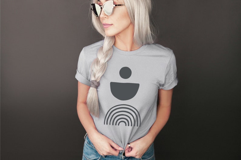 A short sleeve crew neck graphic tee with gray boho shapes on the front. The shirt is Bella Canvas 3001 unisex jersey tee. Available in many colors and sizes. Very soft and high quality.