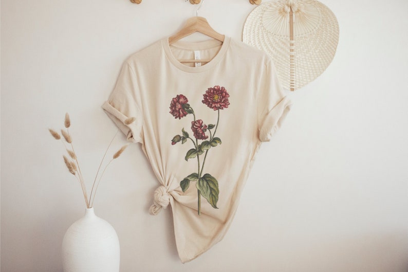 A short sleeve crew neck t shirt with a vintage floral bouquet design. The shirt used is the Bella Canvas 3001 unisex jersey tee and is very soft and high quality. Available in several different colors.