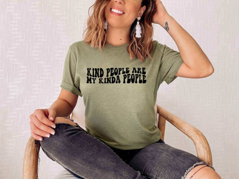 May include: A green t-shirt with the text "Kind people are my kinda people" in black retro font.