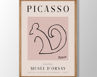 May include: A pink and white poster with a black line drawing of a squirrel. The poster has the text "PICASSO" at the top and "MUSÉE D'ORSAY" at the bottom. The poster also includes the text "SQUIRREL" and "RUE DE LA LÉGION D'HONNEUR - PARIS".
