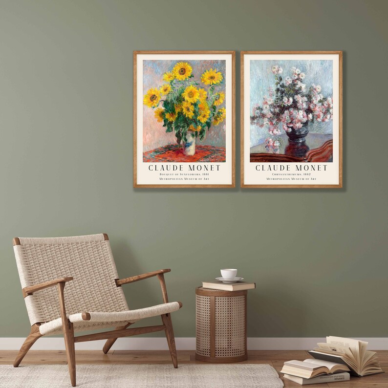May include: Two framed art prints of paintings by Claude Monet. The left print features a bouquet of sunflowers in a vase on a table with a red tablecloth. The right print features a bouquet of white flowers in a vase on a table with a dark brown tablecloth. Both prints include the title of the painting and the year it was created, as well as the Metropolitan Museum of Art.