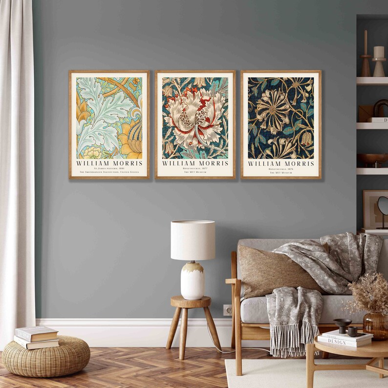 May include: Three framed prints of floral patterns by William Morris. The prints are in a modern style with a vintage feel. The prints are in a living room setting with a couch, a side table, and a lamp.
