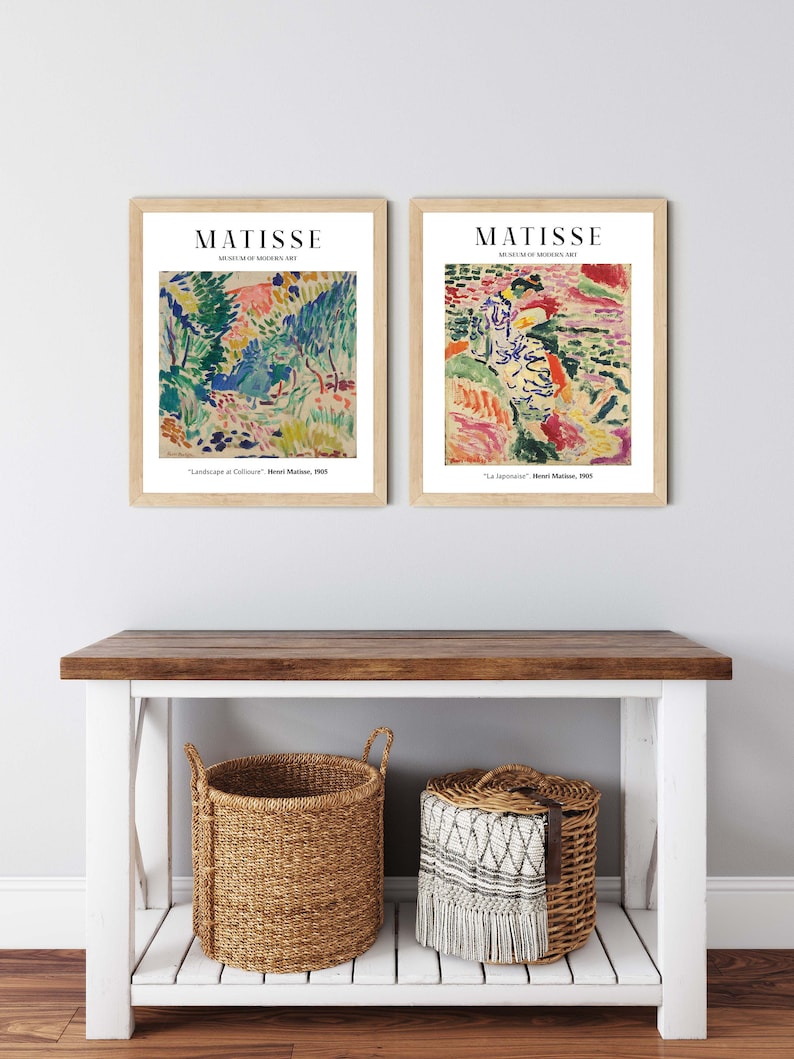 May include: Two framed art prints of paintings by Henri Matisse. The left print is titled "Landscape at Collioure" and the right print is titled "La Japonaise". Both prints are from the Museum of Modern Art.