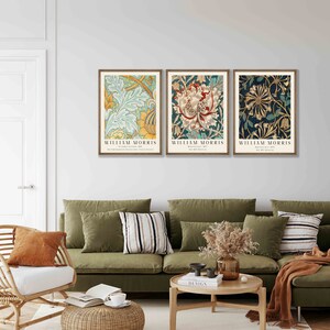 May include: Three framed prints of floral patterns by William Morris. The prints feature a blue and green floral pattern, a red and white floral pattern, and a blue and gold floral pattern.
