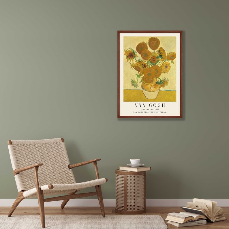 May include: A framed print of a painting by Vincent van Gogh featuring a vase of sunflowers. The painting is titled "Sunflowers" and is from the Van Gogh Museum in Amsterdam.