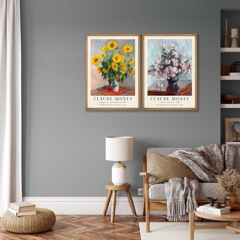 May include: Two framed art prints of flower paintings by Claude Monet. The first print shows a bouquet of sunflowers in a vase on a table. The second print shows a bouquet of white flowers in a vase on a table. Both prints have the artist's name and the title of the painting.
