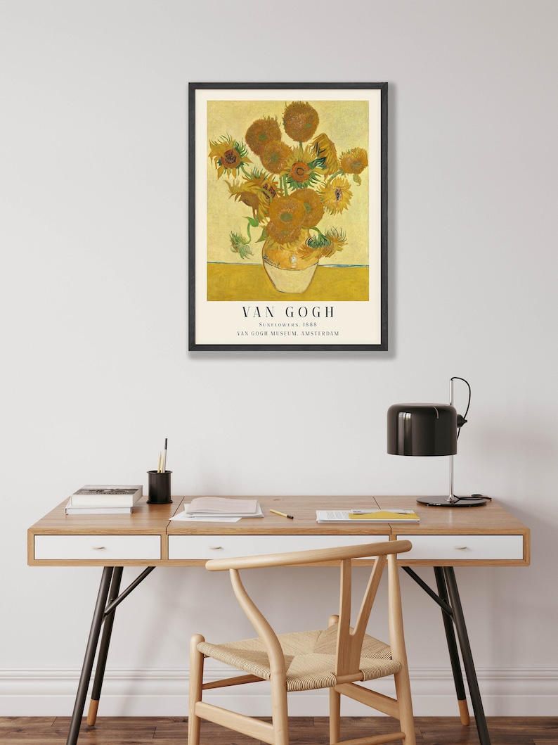 May include: A framed print of a painting by Vincent van Gogh depicting a vase of sunflowers. The painting is titled "Sunflowers, 1888" and is from the Van Gogh Museum in Amsterdam.