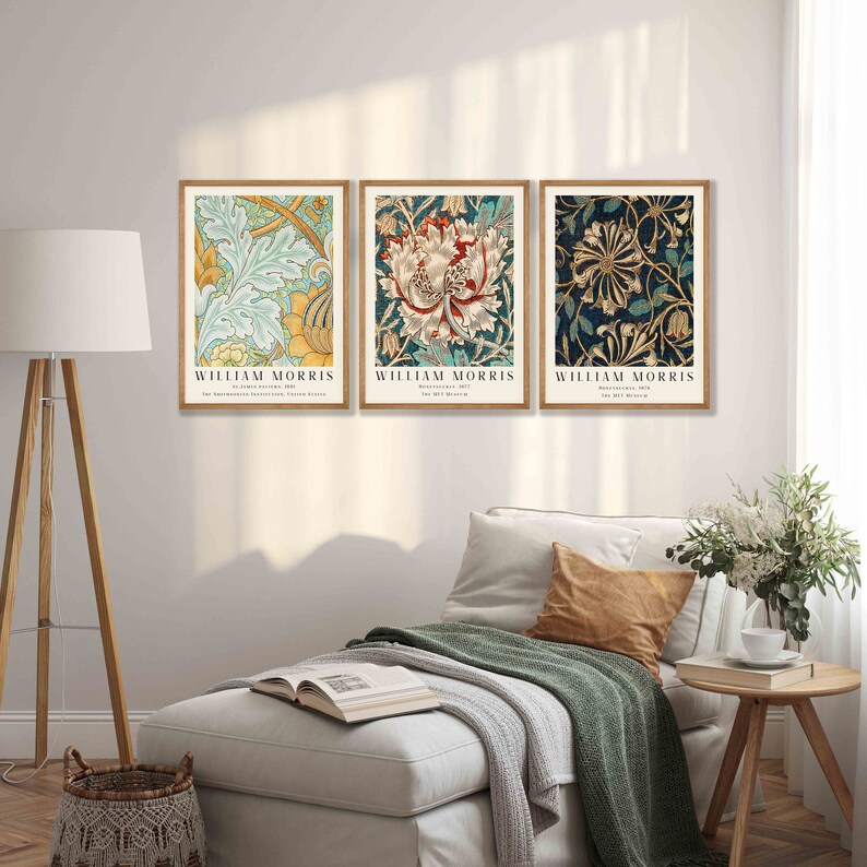 May include: Three framed prints of floral patterns by William Morris. The prints are in a light wood frame and feature a variety of colors, including blue, green, yellow, red, and white.
