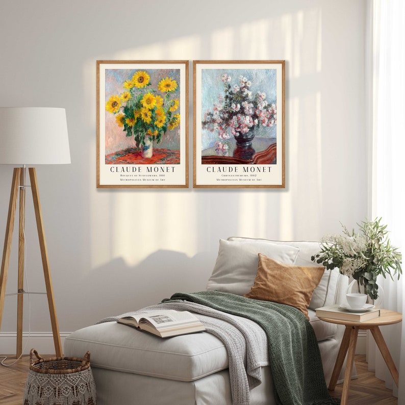May include: Two framed prints of paintings by Claude Monet. The left print shows a vase of sunflowers, the right print shows a vase of white flowers. Both prints have the artist's name and the title of the painting.