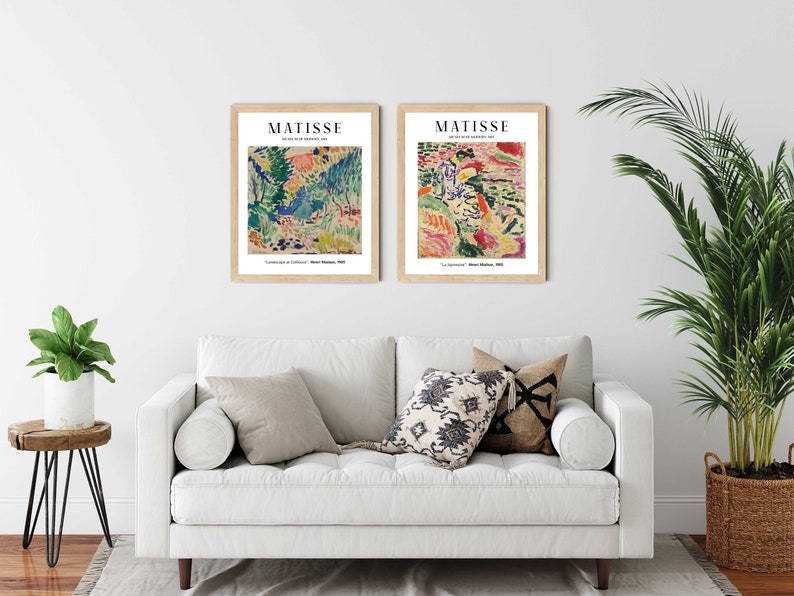 May include: Two framed art prints of paintings by Henri Matisse. The prints are titled "Le Luxe" and "La Danse" and feature abstract, colorful landscapes.