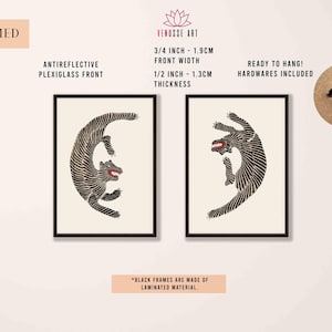 May include: Two black framed prints of stylized black and white animal illustrations. The prints are 3/4 inch wide and 1/2 inch thick. The frames are made of laminated material.
