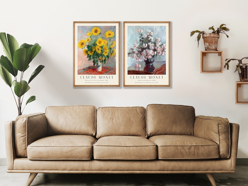 May include: Two framed art prints of paintings by Claude Monet. The left print features a vase of sunflowers, while the right print shows a vase of white flowers. Both prints have a white background and a red and brown table.
