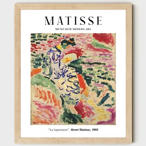 May include: A framed print of a painting by Henri Matisse titled "La Japonaise". The painting features a woman in a colorful dress against a background of abstract shapes and colors.