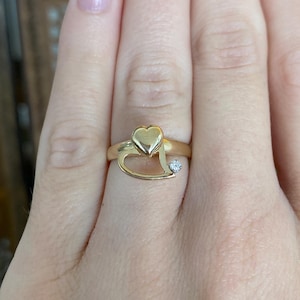 May include: A handmade wooden sign with the text "Welcome to our home" in a handwritten style. The sign is painted white with a dark stained frame. The sign is 12 inches wide and 8 inches tall.