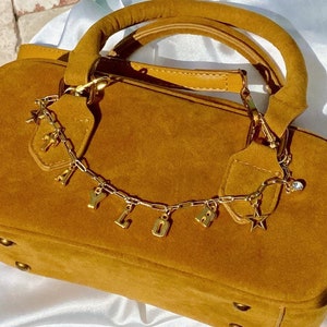 Personalized name purse charm.