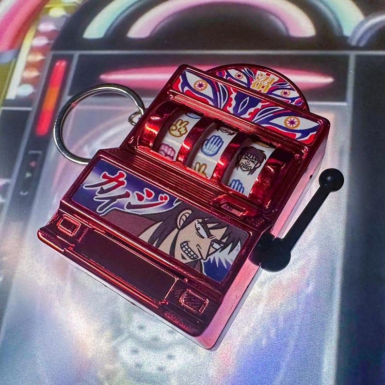 May include: A silver and green shot slot machine with a lever. The machine has a coin slot and a drink line. The machine has a variety of drink options, including rum, orange liqueur, and cranberry juice. The machine has a jackpot shot feature. The text on the machine reads "Shot Slot", "How to Play", "Drink Line", "Coin Slot", "Jackpot Shot", and "Please play responsibly".