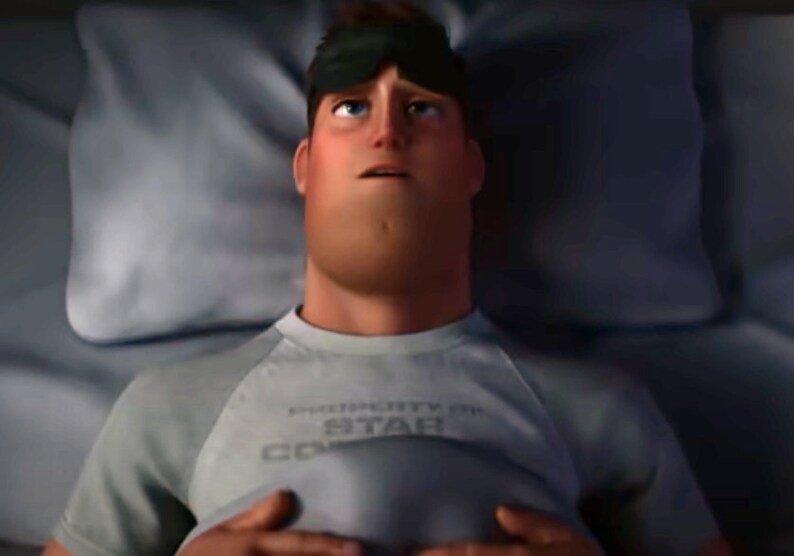 May include: A man wearing a sleep mask lies in bed with a grey t-shirt that says "PRIORITY 1 STAR COMMAND".