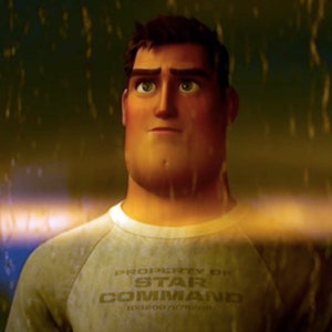 May include: A man with a serious expression looks up at the rain. He is wearing a grey sweatshirt with the text "PROPERTY OF STAR COMMAND 1012007875000" printed on the front.