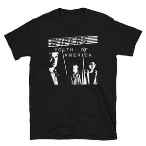 May include: Black t-shirt featuring a white graphic of the band "Wipers" and the text "Youth of America".