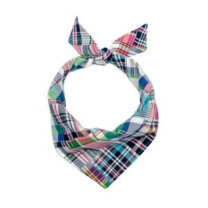 May include: A triangular pet bandana featuring a multi-colored plaid pattern with intersecting lines of navy blue, bright pink, forest green, white, and yellow. The fabric is tied at the top into a knot, creating a pointed shape at the bottom.