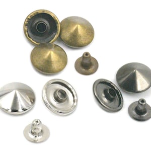 May include: Assortment of metal pyramid-shaped studs in silver, black, and brass finishes. The studs have a flat base and a pointed top. They are used for decorative purposes on clothing, bags, and other accessories.