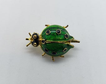 Bug brooch, gold and enamel