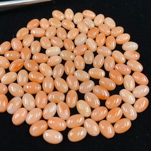 Pedras preciosas ovais de coral rosa em tamanhos variados de 4 x 3 mm a 12 x 10 mm para fabricação de joias