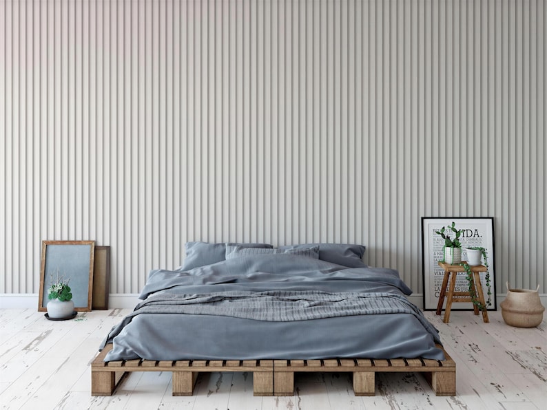 a modern bedroom with a bed, wooden bed frame, and a minimalist design.