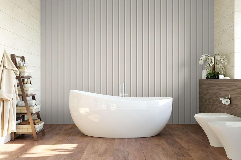 a modern bathroom with a freestanding bathtub, a wooden floor, and a wooden shelf with towels and toiletries.