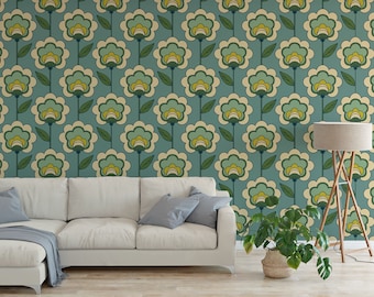 May include: A teal blue wallpaper with a repeating pattern of stylized white flowers with green leaves. The wallpaper is shown in a living room setting with a white couch, a floor lamp, and a potted plant.