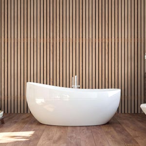 a modern bathroom with a freestanding bathtub, wooden slats on the walls, and a wooden floor.