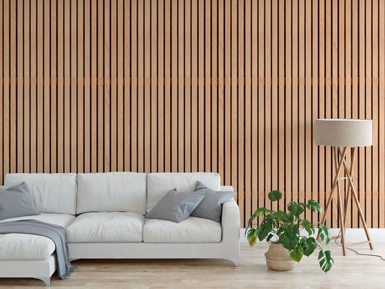 a modern living room with a white sofa, a potted plant, and a wooden wall with vertical slats.