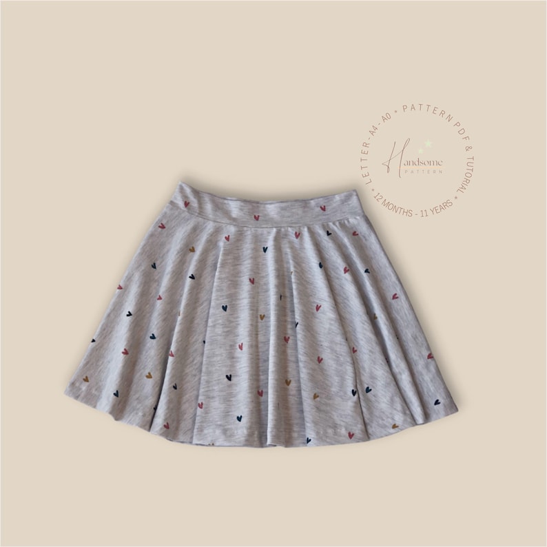 May include: A light grey heathered skater skirt featuring a scattered pattern of small, multi-coloured hearts. The text in the upper right corner reads Handsome Patterns, Pattern PDF & Tutorial, Letter-A4-A0, 12 Months-11 Years.