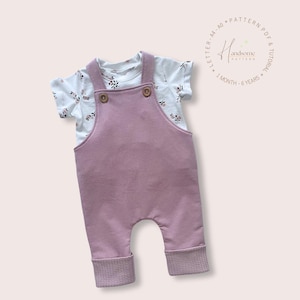 May include: A dusty rose overall with two brown buttons at the chest, layered over a white short-sleeved t-shirt featuring a small floral print. The text "Handsome Pattern" and "LETTER - A4 - A0 * PATTERN PDF & TUTORIAL * 1 MONTH - 6 YEARS" is visible.