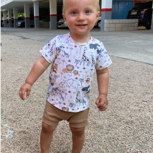 Baby boy with outfit t-shirt and bummmies.