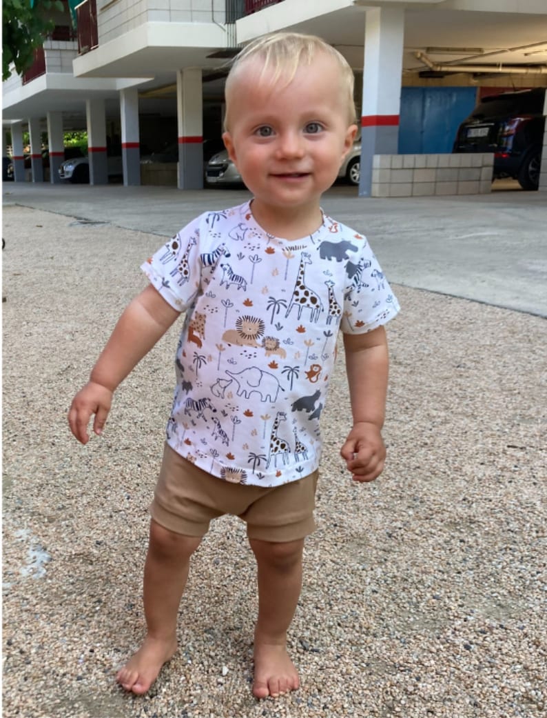 Baby boy with outfit t-shirt and bummmies.