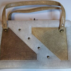 Cartera vintage grande de cuero/vinilo marrón y tostado con diseños geométricos