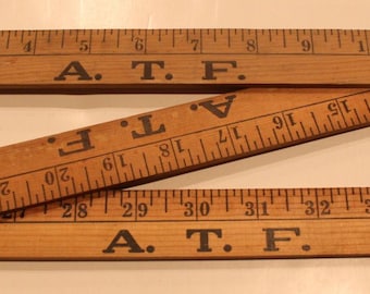 Regla de medición tríptico vintage con etiqueta de la ATF