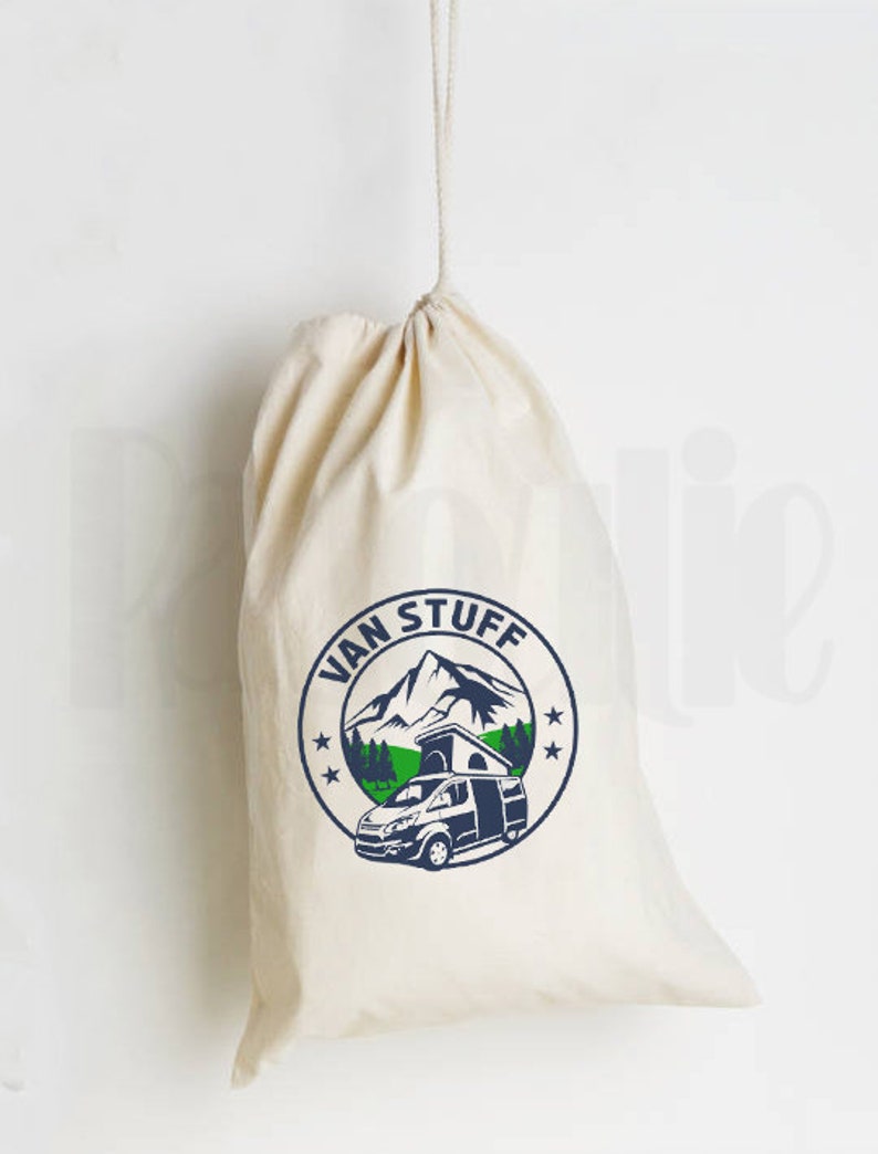 May include: A white canvas drawstring bag with a blue and green logo that says "Van Stuff" and features a mountain scene with a camper van.