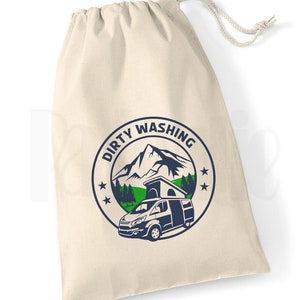 May include: A white canvas drawstring bag with a blue and green logo that says "Dirty Washing" and features a mountain scene with a camper van.