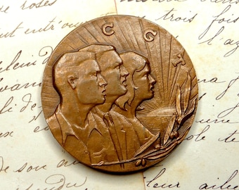 Medalla política de la CGT. Confederación General del Trabajo. Mujer, femenino, hombre. Medalla antigua francesa de bronce.