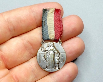 Orphans of firefighters 1938. Antique Medal. Pendant By Pelletier.