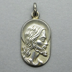 Holy Face of Jesus Christ. Antique Religious Pendant. Silver medal.