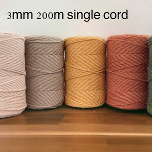 May include: Five spools of 3mm thick single cord in different colours: light pink, beige, yellow, orange, and green. Each spool is 200 metres long.
