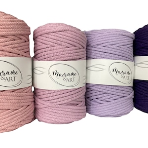 May include: Four spools of cotton cord in shades of pink, lavender, and purple. The cord is labeled "Macrame & ART".