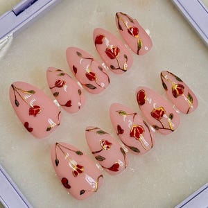 Hand-Painted Press-On Nails – Red Floral with Gold Details on Pink | Reusable False Nails | Elegant Almond Nails | Custom Sizes Available