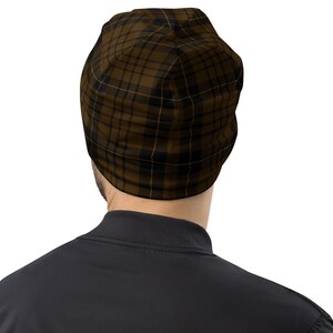 May include: A brown and black plaid beanie hat. The hat is made of a soft, comfortable material and is perfect for keeping your head warm in the winter.