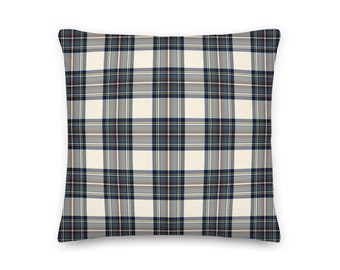 May include: A cream-colored throw pillow with a blue and gray plaid pattern.